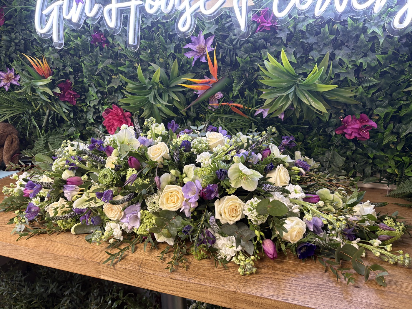 Coffin spray of seasonal flowers and foliage by Gin House Flowers