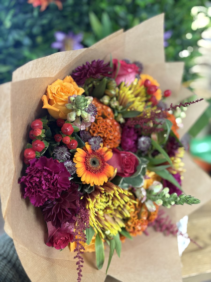 Example hand tied bouquet in paper wrap