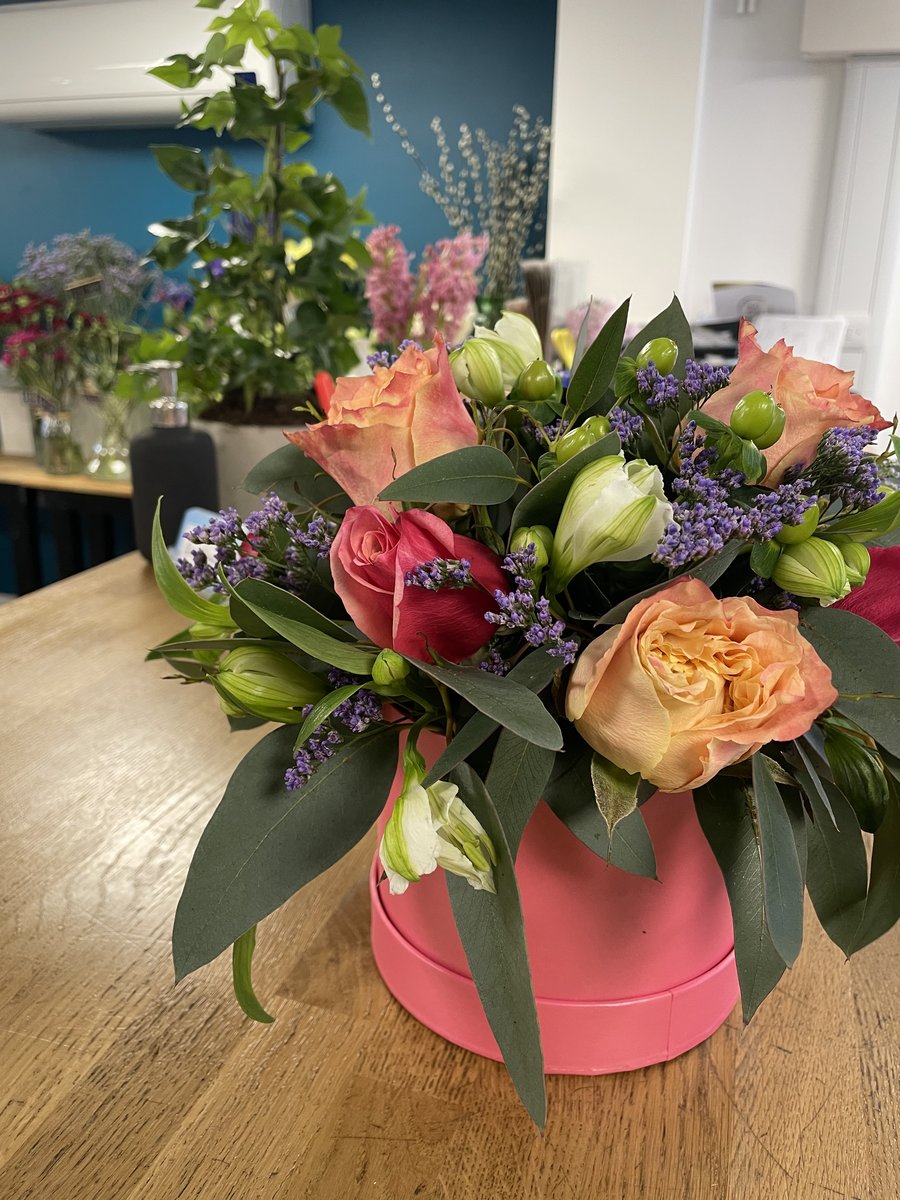 Example hat box arrangement with seasonal flowers