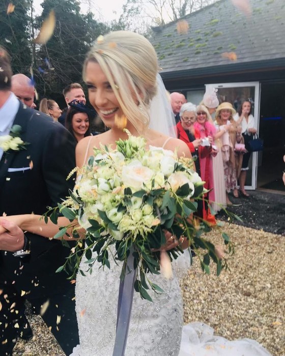 Bride with a white and green bouquet
