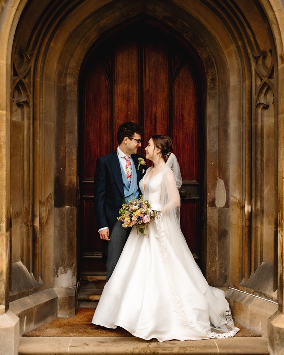 Couple in a stone church doorway